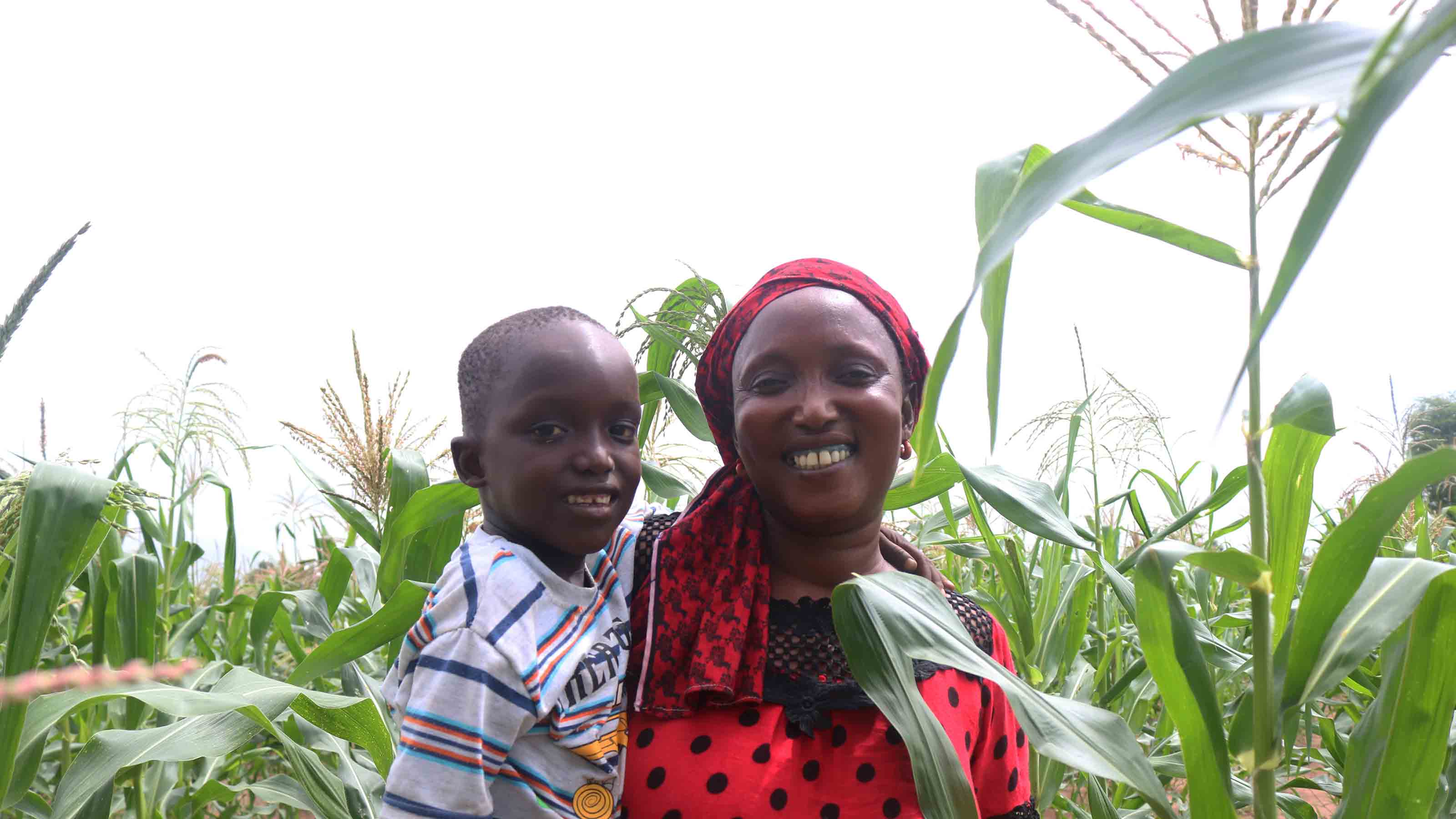 Mother and child smiling at the field