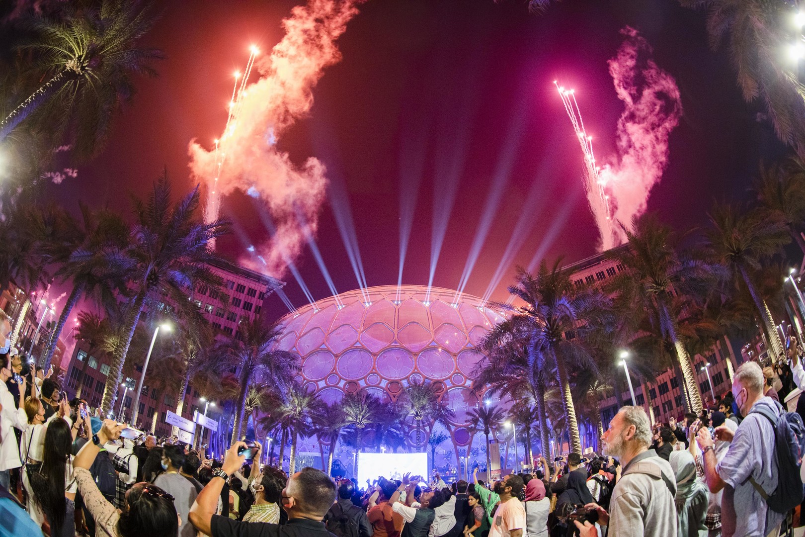 Visitors watch the Expo 2020 Dubai Closing Ceremony Fireworks over Al Wasl