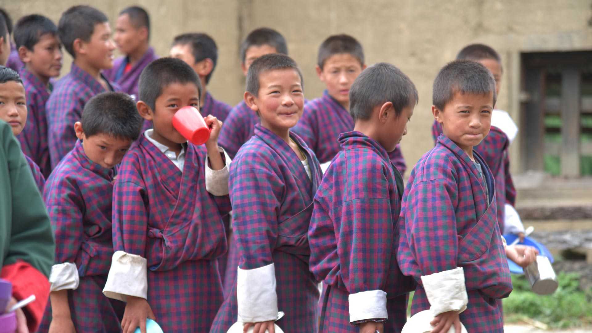 Pupils from Bhutan queuing for meal 