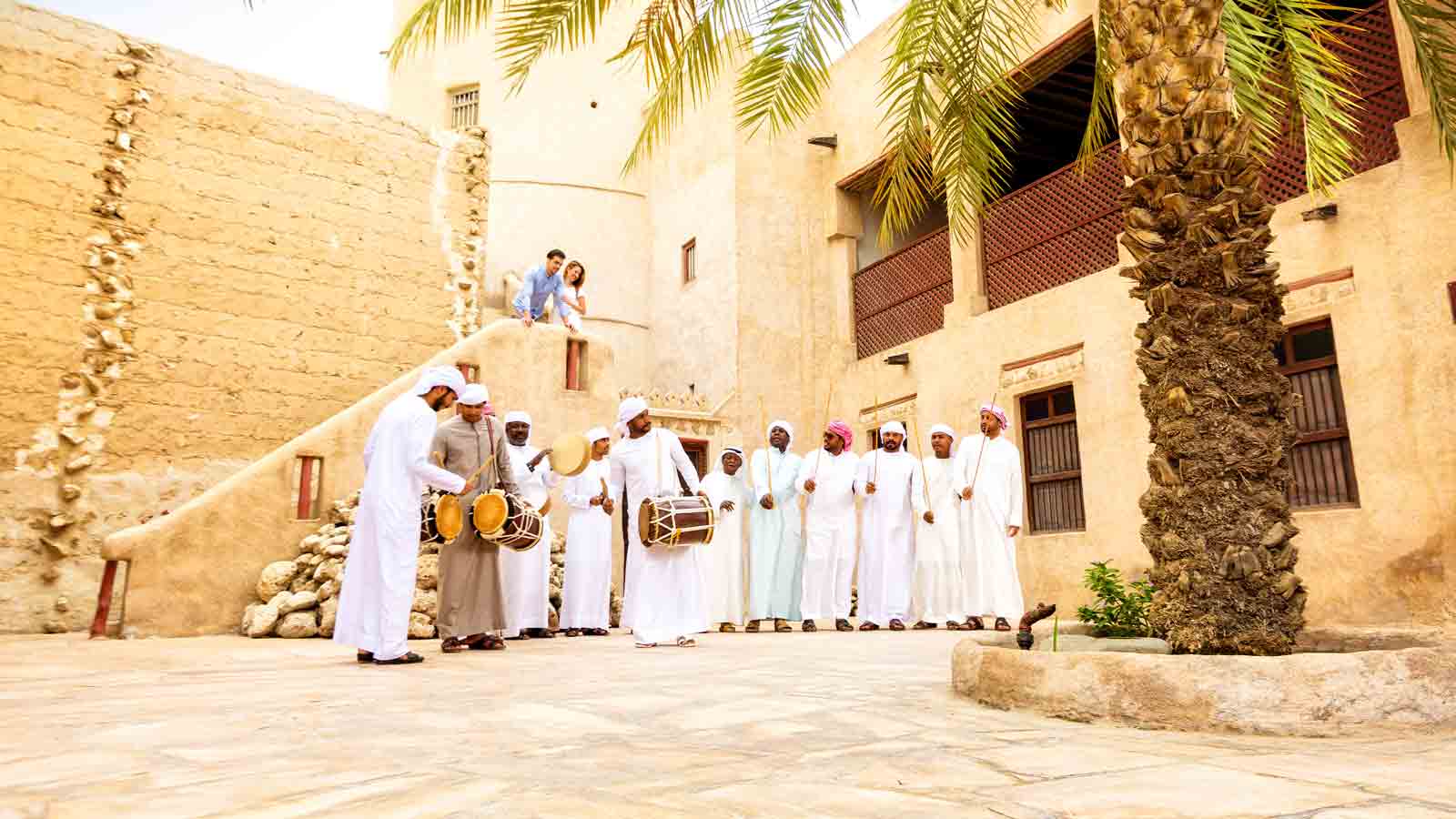 Emirati men dancing in Ajman Museum